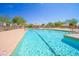 Community swimming pool with ample space at 10923 W Escuda Dr, Sun City, AZ 85373