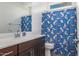 Bathroom with dark brown vanity and shark-themed shower curtain at 2512 N Morrison Ave, Casa Grande, AZ 85122