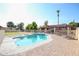 Sparkling pool with a brick patio and covered patio at 4112 W Paradise Ln, Phoenix, AZ 85053