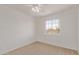 Well-lit bedroom with ceiling fan and carpet flooring at 5971 W Venus Way, Chandler, AZ 85226
