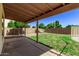 Covered patio with a view of the grassy backyard and pool at 5971 W Venus Way, Chandler, AZ 85226