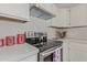 Modern kitchen with stainless steel appliances and white cabinets at 5971 W Venus Way, Chandler, AZ 85226