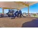 Modern playground equipment under a shaded structure at 9539 W Villa Chula --, Peoria, AZ 85383