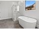 Bathroom with soaking tub and walk-in shower at 42158 N Golden Trl, San Tan Valley, AZ 85140