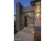 Elegant entryway with a modern metal gate and stone accents at 19617 N 39Th Dr, Glendale, AZ 85308