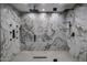 Large walk-in shower with marble tile and rainfall shower head at 19617 N 39Th Dr, Glendale, AZ 85308
