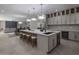 Modern kitchen with large island, stainless steel appliances, and ample cabinet space at 19617 N 39Th Dr, Glendale, AZ 85308