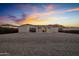 Spacious backyard with gravel and a view of the sunset at 19617 N 39Th Dr, Glendale, AZ 85308