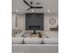 Living room with modern fireplace and sectional sofa at 19617 N 39Th Dr, Glendale, AZ 85308