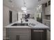 Open kitchen with large island and stainless steel appliances at 19617 N 39Th Dr, Glendale, AZ 85308