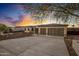 Modern home exterior with a two-car garage and landscaped yard at 19617 N 39Th Dr, Glendale, AZ 85308