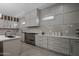 Modern kitchen with stainless steel appliances and herringbone backsplash at 19617 N 39Th Dr, Glendale, AZ 85308