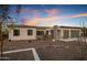 Modern home exterior at dusk at 19617 N 39Th Dr, Glendale, AZ 85308