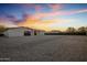Large backyard with gravel landscaping and sunset view at 19617 N 39Th Dr, Glendale, AZ 85308