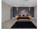 Main bedroom with dark accent wall, plush carpet, and en-suite bathroom at 19617 N 39Th Dr, Glendale, AZ 85308