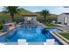 Inviting backyard oasis featuring a sparkling pool,waterfall, and covered patio at 19617 N 39Th Dr, Glendale, AZ 85308