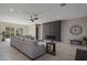 Open living room showcasing a large sectional and fireplace at 19617 N 39Th Dr, Glendale, AZ 85308