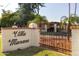 Community entrance with wrought iron gate and signage at 6501 N Villa Manana Dr, Phoenix, AZ 85014