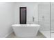 Luxurious bathroom with a freestanding tub and walk-in shower at 2325 N 64Th St, Scottsdale, AZ 85257