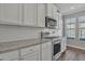 Modern kitchen with white shaker cabinets and granite counters at 2616 S Tobin --, Mesa, AZ 85209