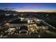 Grand estate at night with pool and hangar at 21868 E Stacey Rd, Queen Creek, AZ 85142