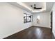 Bright bedroom with dark hardwood floors and large windows at 21868 E Stacey Rd, Queen Creek, AZ 85142