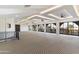 Large bonus room with abundant natural light and high ceilings at 21868 E Stacey Rd, Queen Creek, AZ 85142