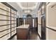 Large walk-in closet with ample shelving and island at 21868 E Stacey Rd, Queen Creek, AZ 85142