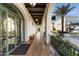 A covered walkway with arched entryways and terracotta tile flooring at 21868 E Stacey Rd, Queen Creek, AZ 85142