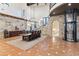 Spacious dining area with stone walls, a grand table, and a modern elevator at 21868 E Stacey Rd, Queen Creek, AZ 85142