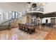 Elegant dining room with a large wood table and access to the kitchen at 21868 E Stacey Rd, Queen Creek, AZ 85142