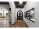 Back entry with arched doors and views into the home at 21868 E Stacey Rd, Queen Creek, AZ 85142