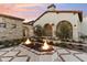 Inviting fire pit area with brick surround, enhancing outdoor living space at 21868 E Stacey Rd, Queen Creek, AZ 85142