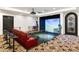 Game room boasts golf simulator, arcade game, and seating at 21868 E Stacey Rd, Queen Creek, AZ 85142