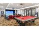 Basement game room with pool table and golf simulator at 21868 E Stacey Rd, Queen Creek, AZ 85142