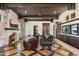 Gathering room boasts a fireplace, leather seating, and wet bar at 21868 E Stacey Rd, Queen Creek, AZ 85142