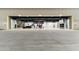 Private hangar with large doors, car, and jet at 21868 E Stacey Rd, Queen Creek, AZ 85142