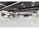 Private hangar featuring a jet and luxury vehicle at 21868 E Stacey Rd, Queen Creek, AZ 85142