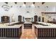 Spacious kitchen with large island, custom cabinetry, and terracotta tile floors at 21868 E Stacey Rd, Queen Creek, AZ 85142