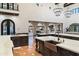 Large kitchen with island, opens to a resort-style backyard with pool at 21868 E Stacey Rd, Queen Creek, AZ 85142