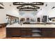 Open concept kitchen with island, custom cabinetry, and views to backyard oasis at 21868 E Stacey Rd, Queen Creek, AZ 85142