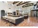 Open kitchen features a large island, custom cabinetry, and high ceilings at 21868 E Stacey Rd, Queen Creek, AZ 85142