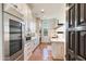 Bright laundry room with custom cabinetry and herringbone tile floor at 21868 E Stacey Rd, Queen Creek, AZ 85142