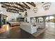 Spacious living area with a large sectional sofa and access to a pool at 21868 E Stacey Rd, Queen Creek, AZ 85142