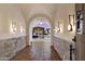 View of a backyard pool through an arched hallway at 21868 E Stacey Rd, Queen Creek, AZ 85142