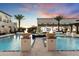 Expansive pool and fire features with views of hangar at 21868 E Stacey Rd, Queen Creek, AZ 85142