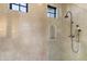 Modern shower with glass enclosure and arched niche at 21868 E Stacey Rd, Queen Creek, AZ 85142