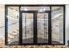 Wine cellar with glass doors and stone wall at 21868 E Stacey Rd, Queen Creek, AZ 85142