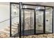 Wine cellar entrance with glass doors and staircase at 21868 E Stacey Rd, Queen Creek, AZ 85142