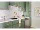 Modern kitchen with white quartz countertops and sleek green cabinets at 7350 N Via Paseo Del Sur -- # P202, Scottsdale, AZ 85258